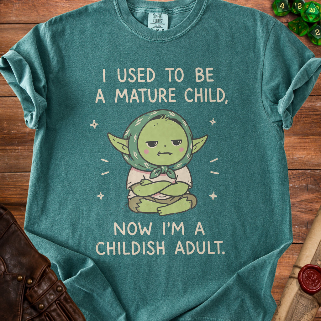Green t-shirt with "I used to be a mature child, now I'm a childish adult" text.