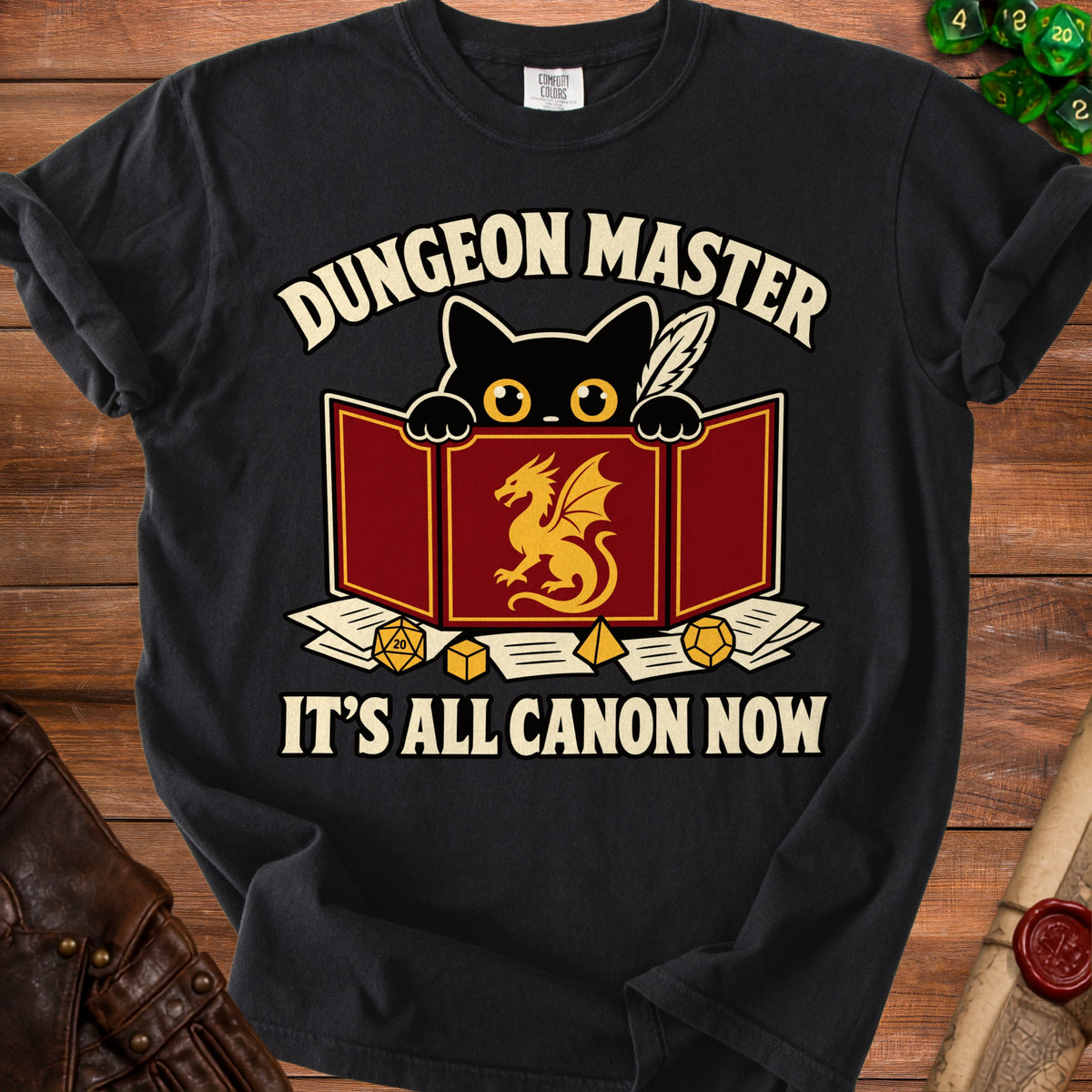 Black t-shirt with "Dungeon Master It's All Canon Now" and a black cat peering over a game screen.