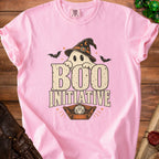 Pink t-shirt with ghost, bats, and text "Boo Initiative" and a D20 die.