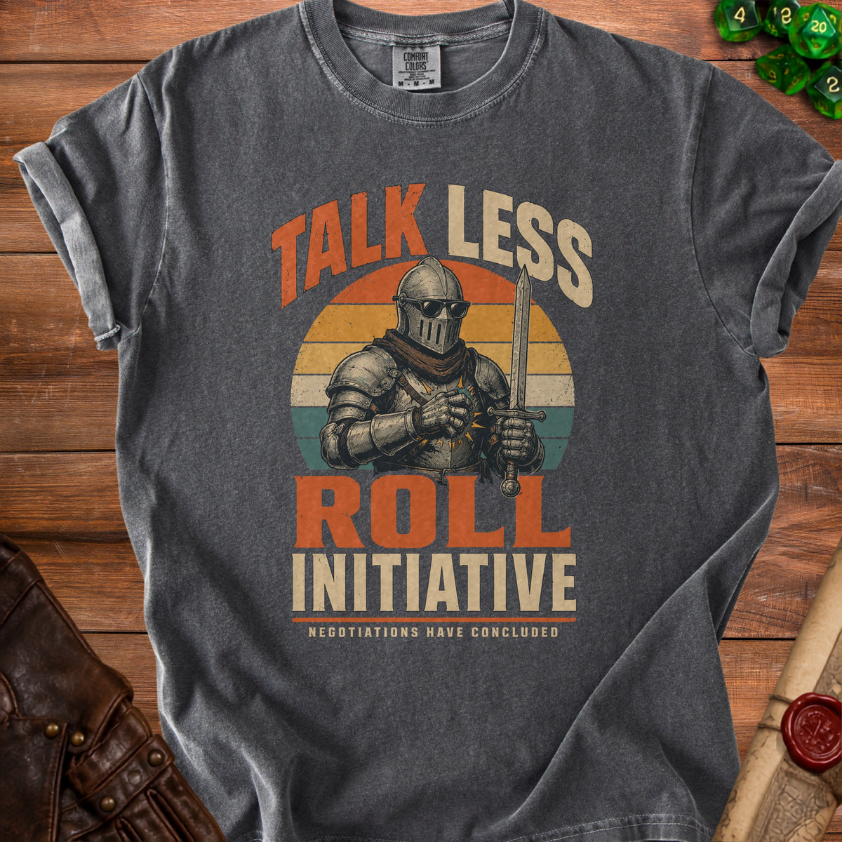 Dark t-shirt graphic with knight, sword, sunglasses, and text: "Talk Less Roll Initiative".