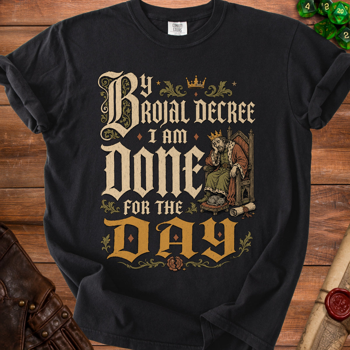 Black t-shirt with "By Royal Decree I Am Done For The Day" text and king illustration.