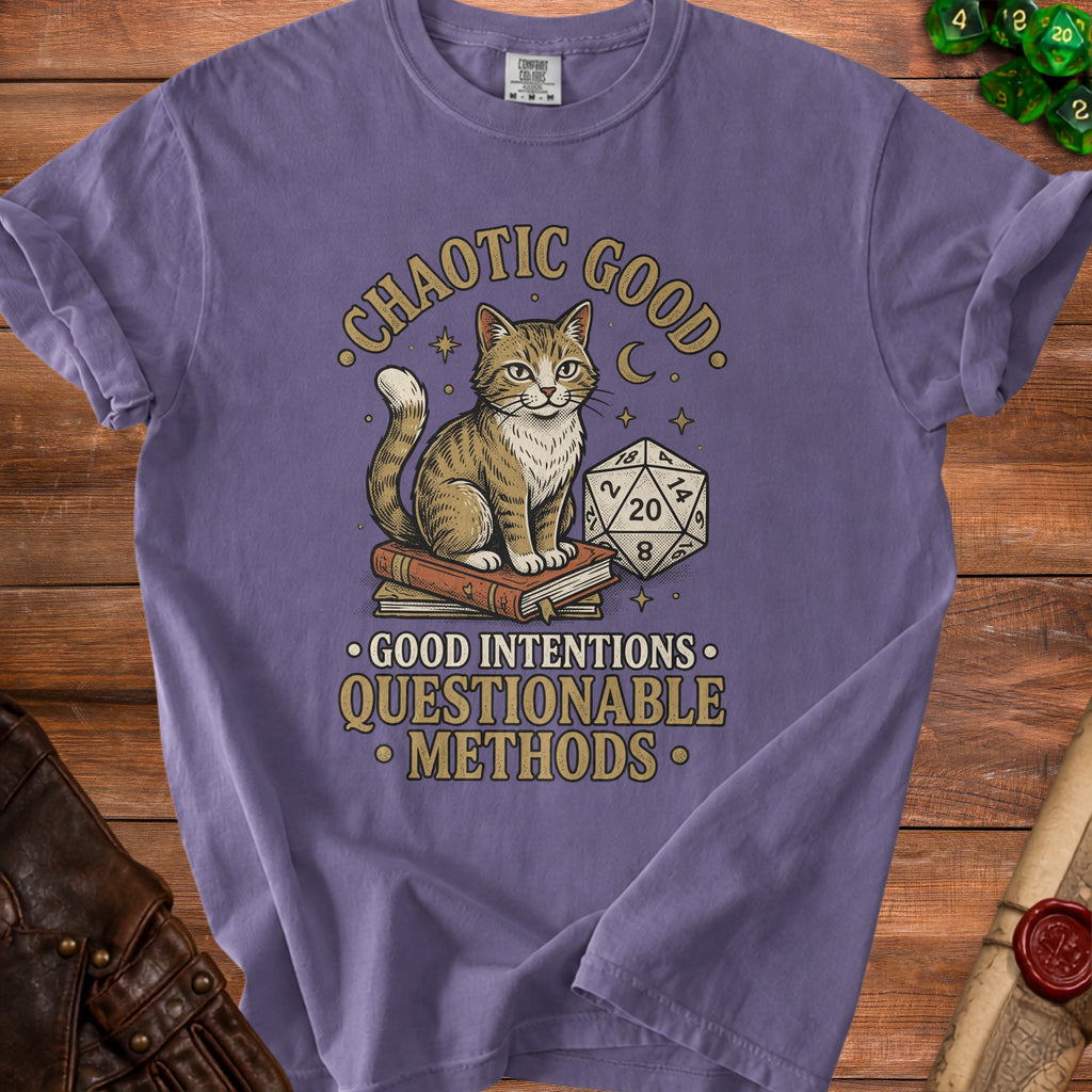 T-shirt with a cat sitting on books, dice, and text "Chaotic Good. Good Intentions. Questionable Methods."