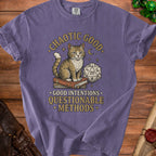 T-shirt with a cat sitting on books, dice, and text "Chaotic Good. Good Intentions. Questionable Methods."