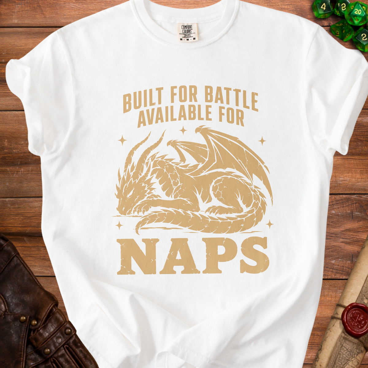 White t-shirt with gold dragon graphic and text "Built for Battle Available for Naps".