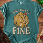 Teal t-shirt with "Critically Fine" text and a damaged d20 die.