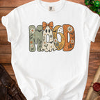 White t-shirt with "Mood" text featuring a ghost, moon, and floral designs.