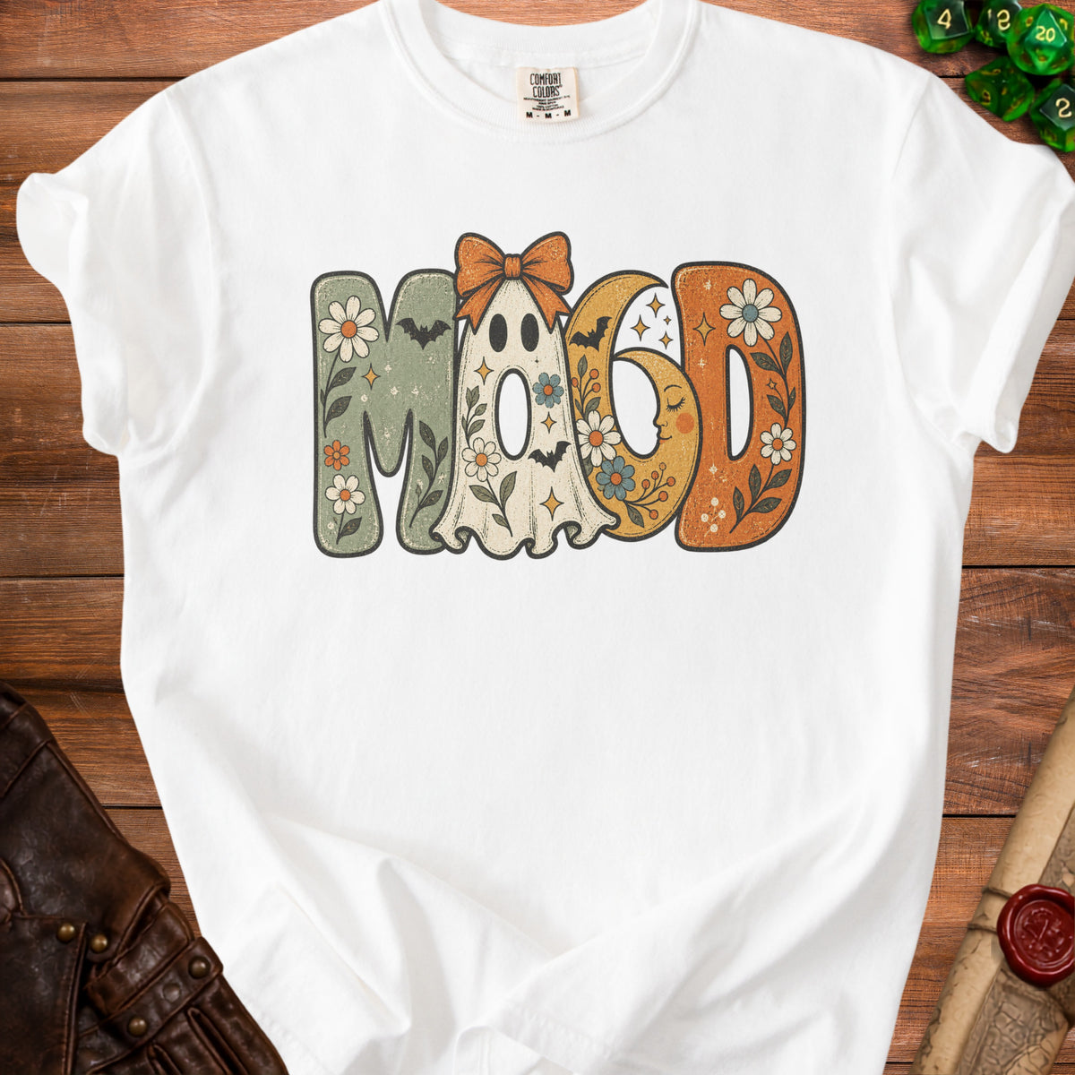 White t-shirt with "Mood" text featuring a ghost, moon, and floral designs.