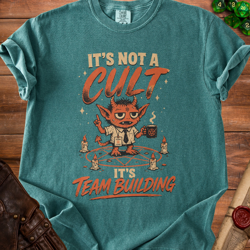 Teal t-shirt with devil graphic, pentagram, candles, and text "It's Not A Cult It's Team Building".
