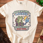 Cream t-shirt with pixel art of a bored frog, suitcase, and lock with text "ADVENTURE LOCKED EMPLOYMENT ACTIVE".