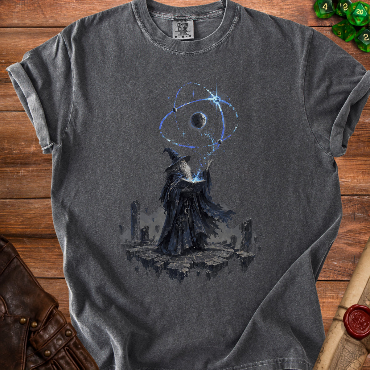 Dark t-shirt with wizard casting a spell over a celestial orb graphic.