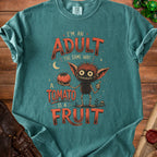 T-shirt with a cartoon monster holding a tomato and text about adults and fruits.