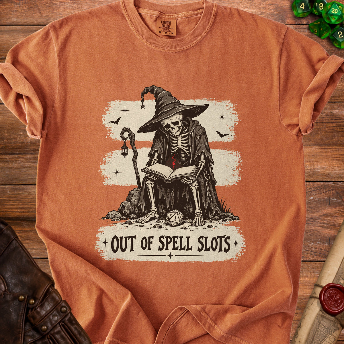 Skeleton wizard reading a book on rocks with "Out of Spell Slots" text.