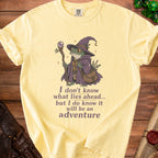 Yellow t-shirt with a frog wizard graphic and "adventure" quote.