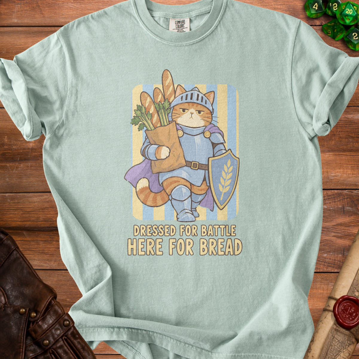 Cat in armor holding groceries, text "DRESSED FOR BATTLE HERE FOR BREAD".