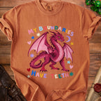 Orange t-shirt with a pink dragon and colorful text reading "MY BOUNDARIES HAVE TEETH".