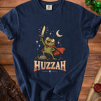 Frog with sword and cape, under moon and stars, with "HUZZAH" text.