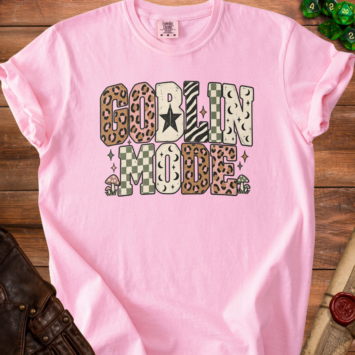 Pink t-shirt with "GOBLIN MODE" text in distressed, patterned letters.