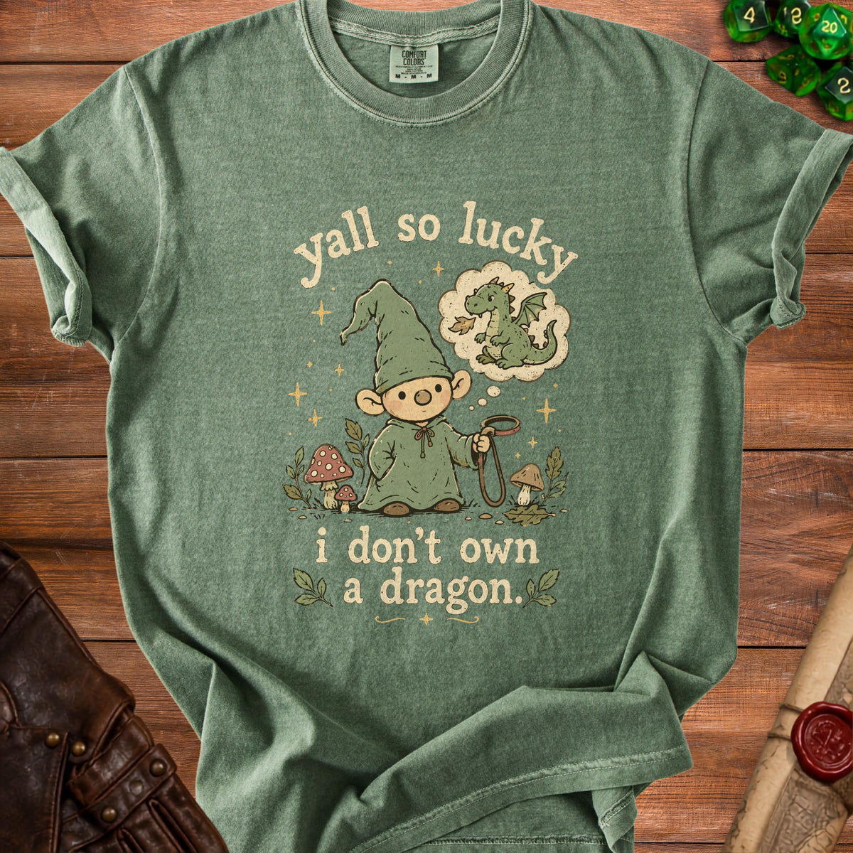 Green t-shirt with gnome dreaming of a dragon and text "yall so lucky i don't own a dragon".