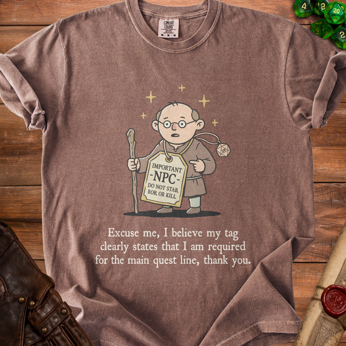 Brown t-shirt with cartoon of NPC holding staff, tag says "IMPORTANT -NPC- DO NOT STAB, ROB, OR KILL."