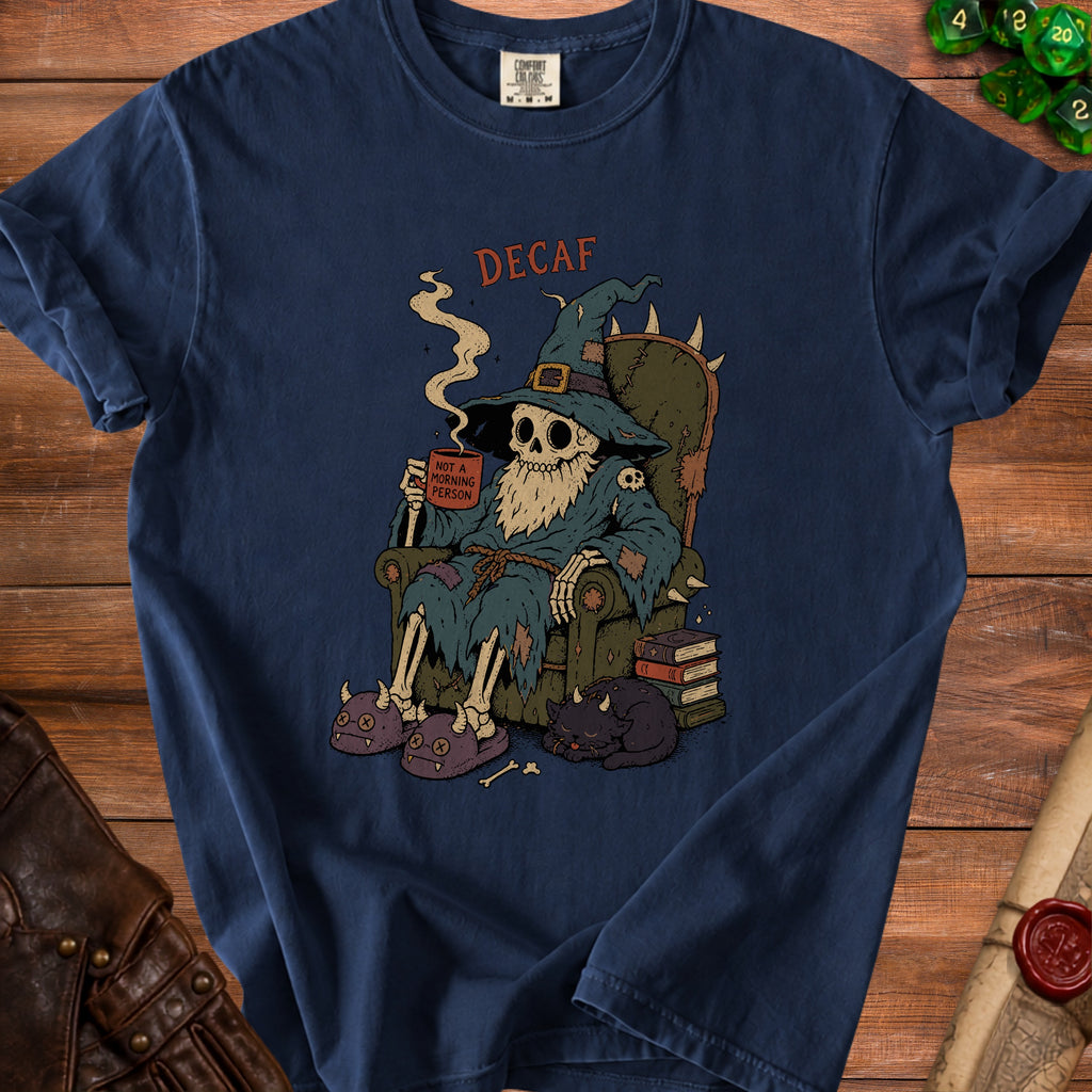 Skeleton wizard in robe and hat sits in chair holding coffee cup with "Decaf" and "Not a morning person" text.
