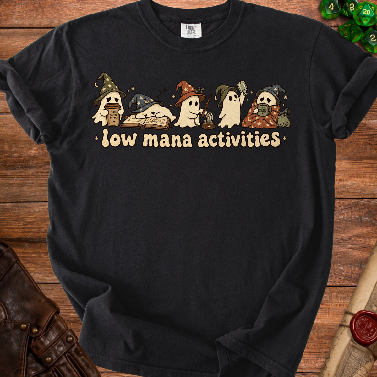 Black t-shirt with cartoon ghosts reading, drinking coffee, and casting spells.