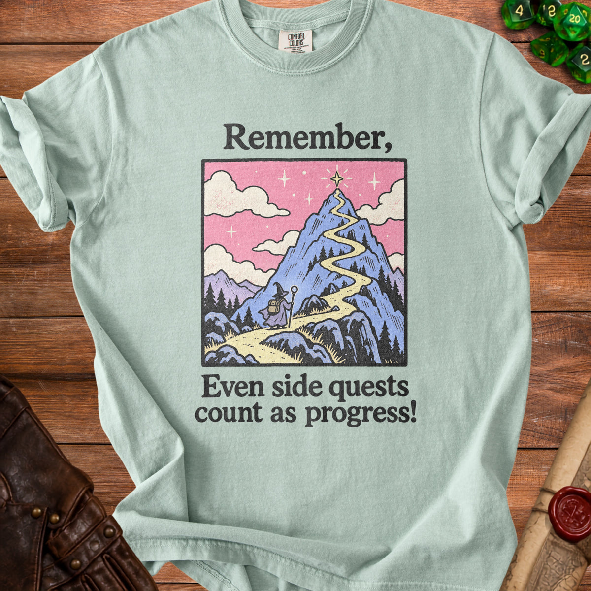 T-shirt with "Remember, Even side quests count as progress!" text and mountain graphic.