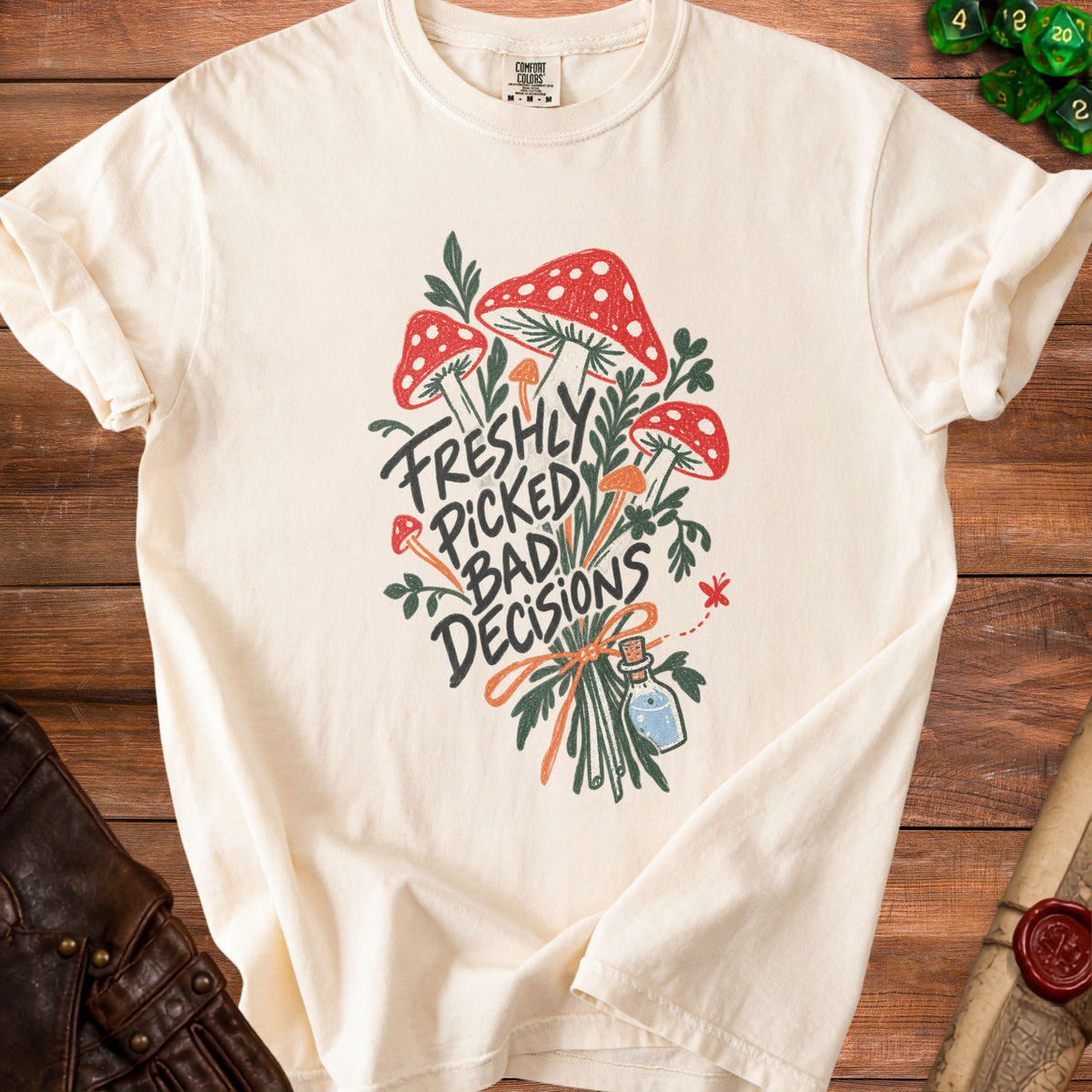 Cream t-shirt with red and white mushrooms and "Freshly Picked Bad Decisions" text.