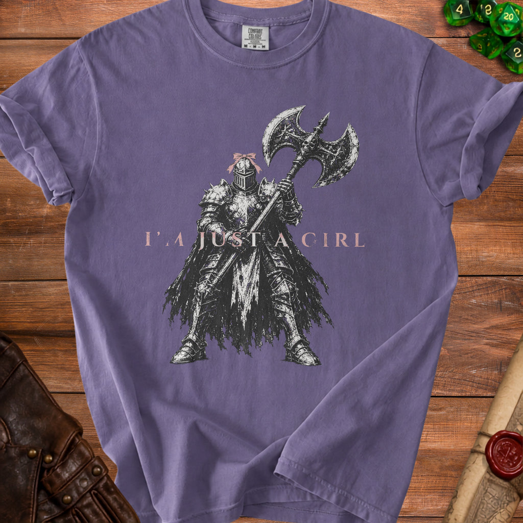 Purple t-shirt with illustration of knight holding axe and text "I'M JUST A GIRL".