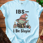 Light blue t-shirt with "IBS- I Be Slayin'" text and a goblin reading a book.