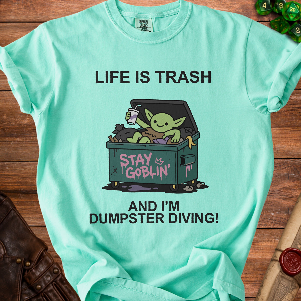 T-shirt graphic with text "Life is trash and I'm dumpster diving!".