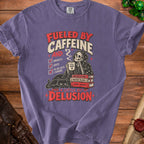 Purple t-shirt graphic: Fueled by Caffeine and a little bit of Delusion.