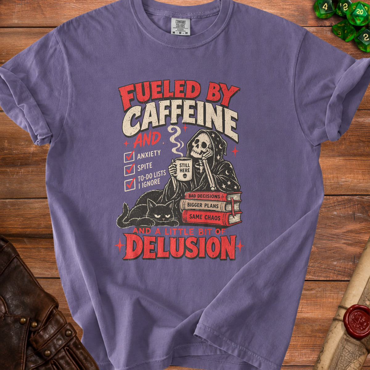 Purple t-shirt graphic: Fueled by Caffeine and a little bit of Delusion.