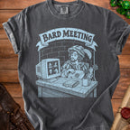 T-shirt graphic featuring a bard playing lute in front of a computer screen with icons.