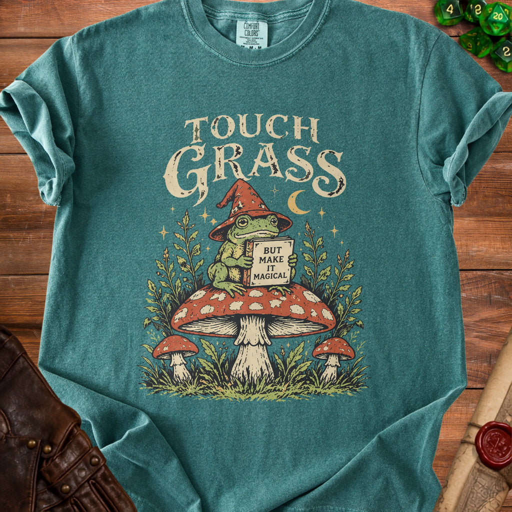 Teal t-shirt with wizard frog on mushroom, reads "Touch Grass But Make It Magical".