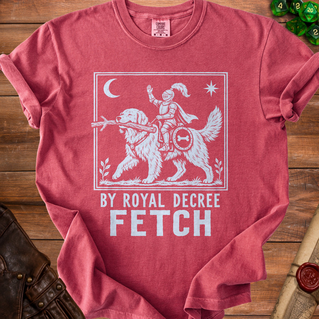 Red t-shirt with a knight on a dog graphic and "By Royal Decree Fetch" text.