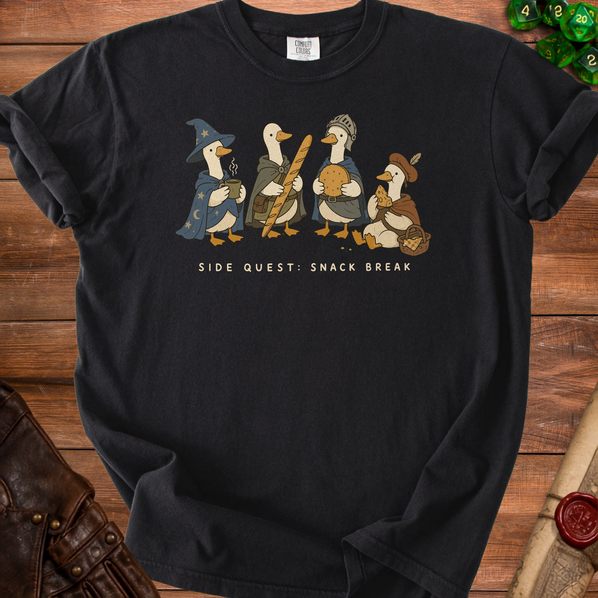 Four cartoon ducks dressed as fantasy characters on a black t-shirt with text.