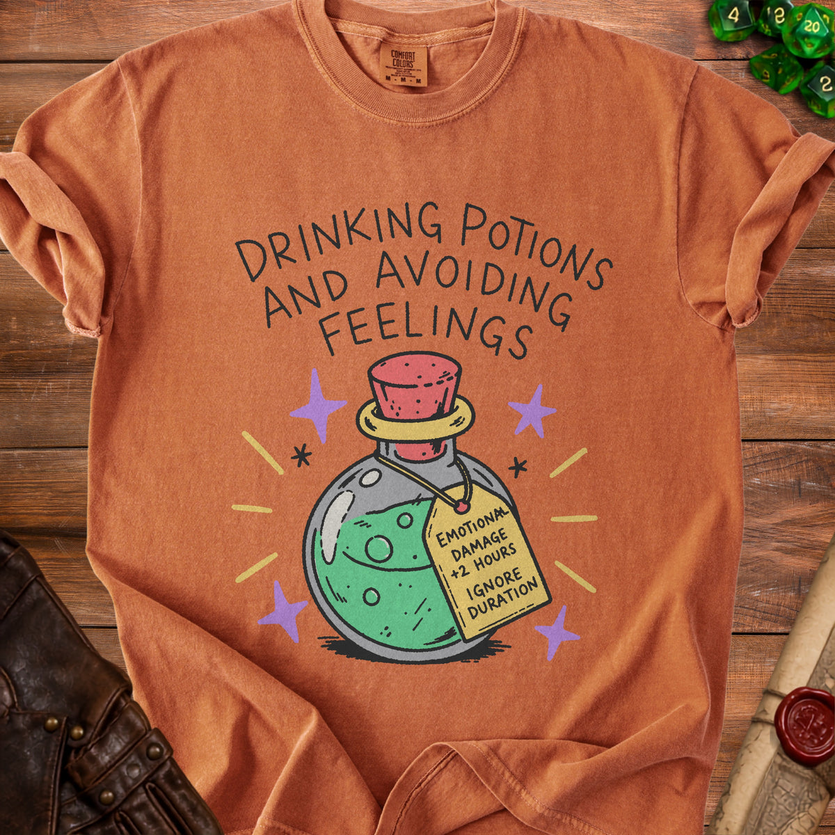 Orange t-shirt with "Drinking Potions and Avoiding Feelings" and a potion bottle graphic.