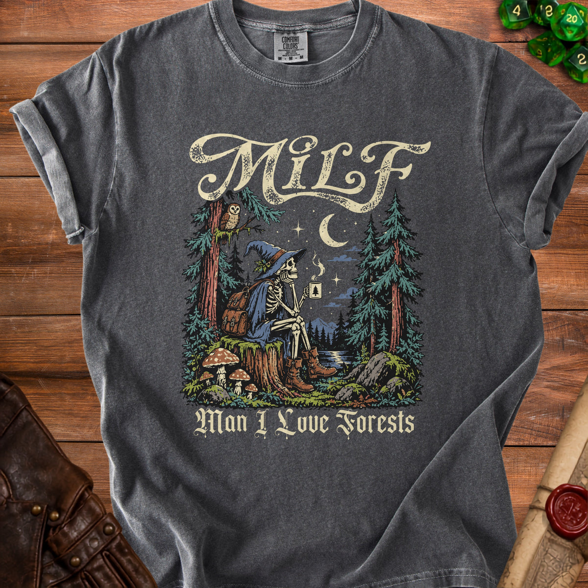 Skeleton in witch hat with coffee in forest with text "MILF Man I Love Forests."