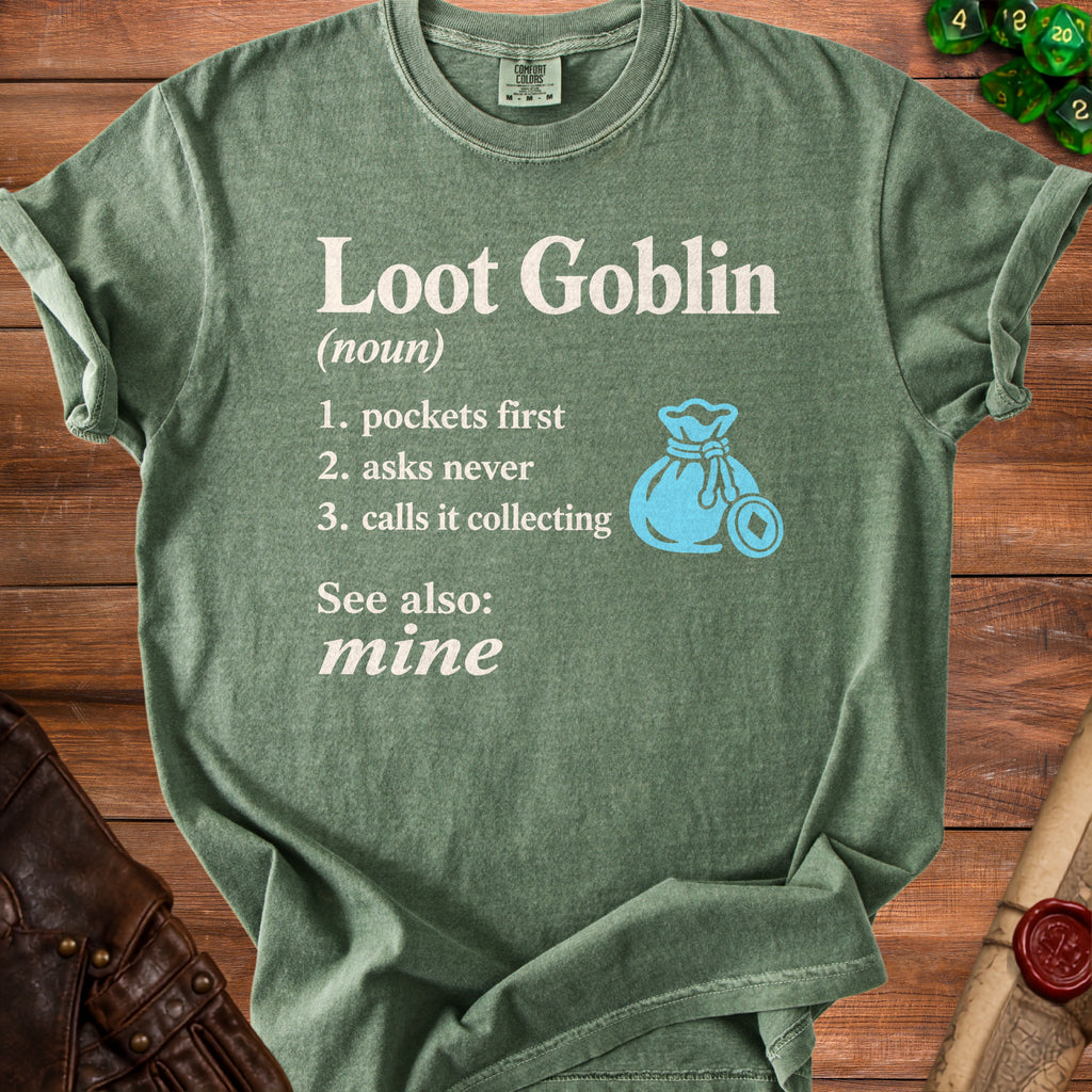 Green t-shirt with "Loot Goblin" definition and blue coin bag graphic.
