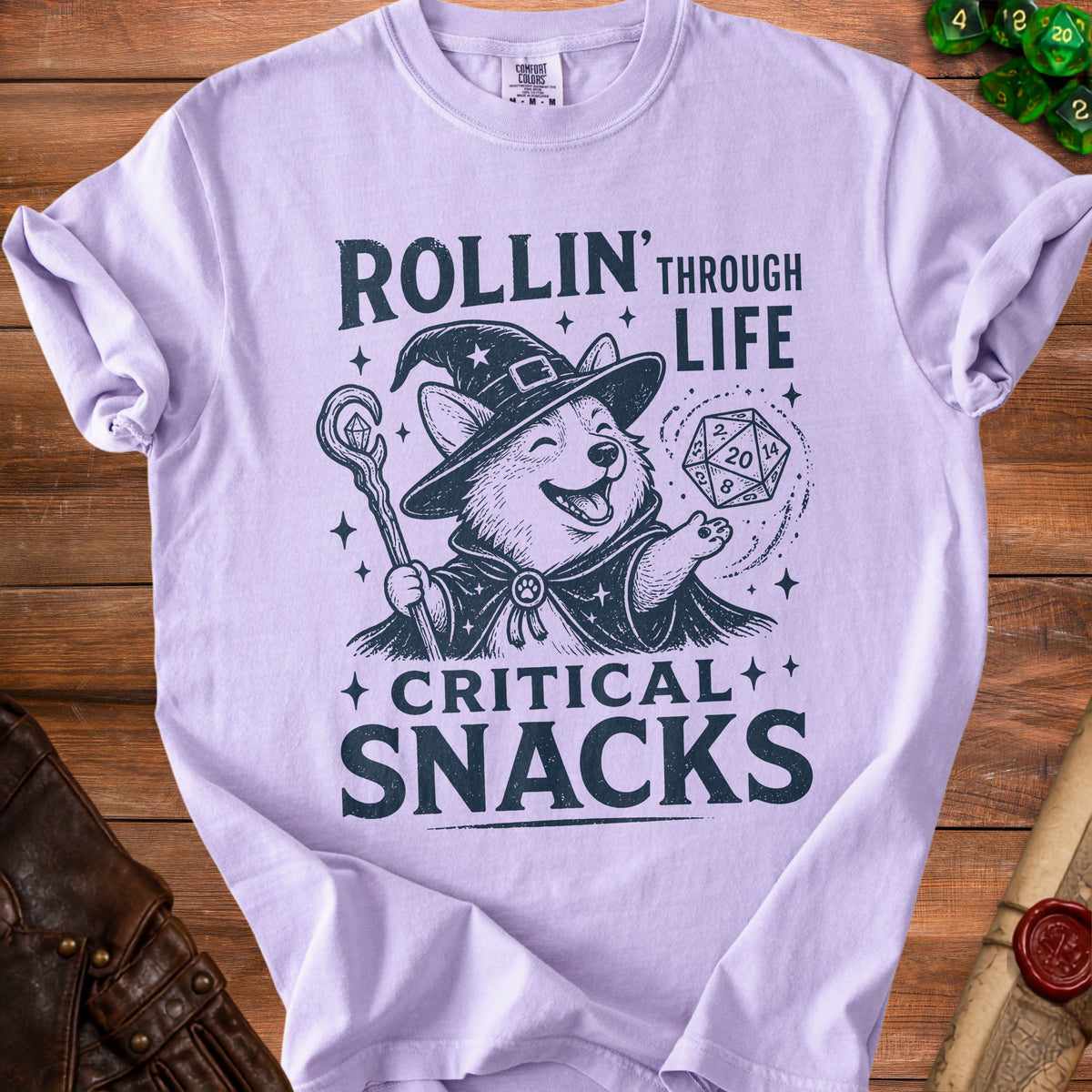 T-shirt with a corgi wizard graphic saying "Rollin' Through Life Critical Snacks".