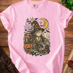 Pink t-shirt with a wizard frog and Halloween-themed graphic featuring a pumpkin and ghost.