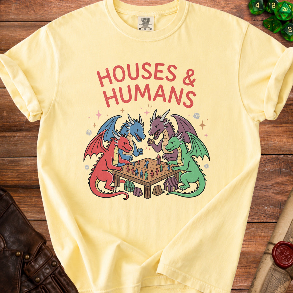 Yellow t-shirt with "HOUSES & HUMANS" text and dragons playing a board game.