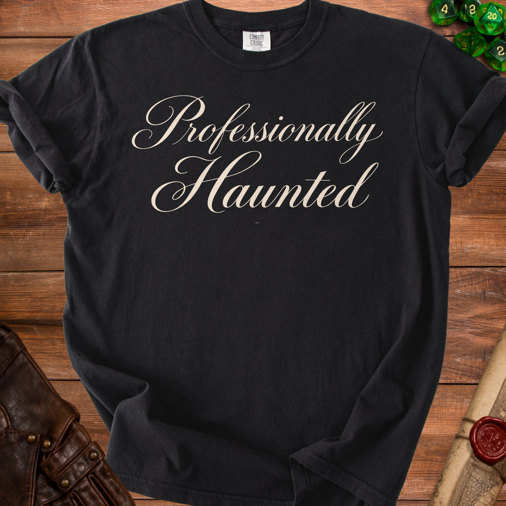 Black t-shirt with "Professionally Haunted" text in creamy script font.