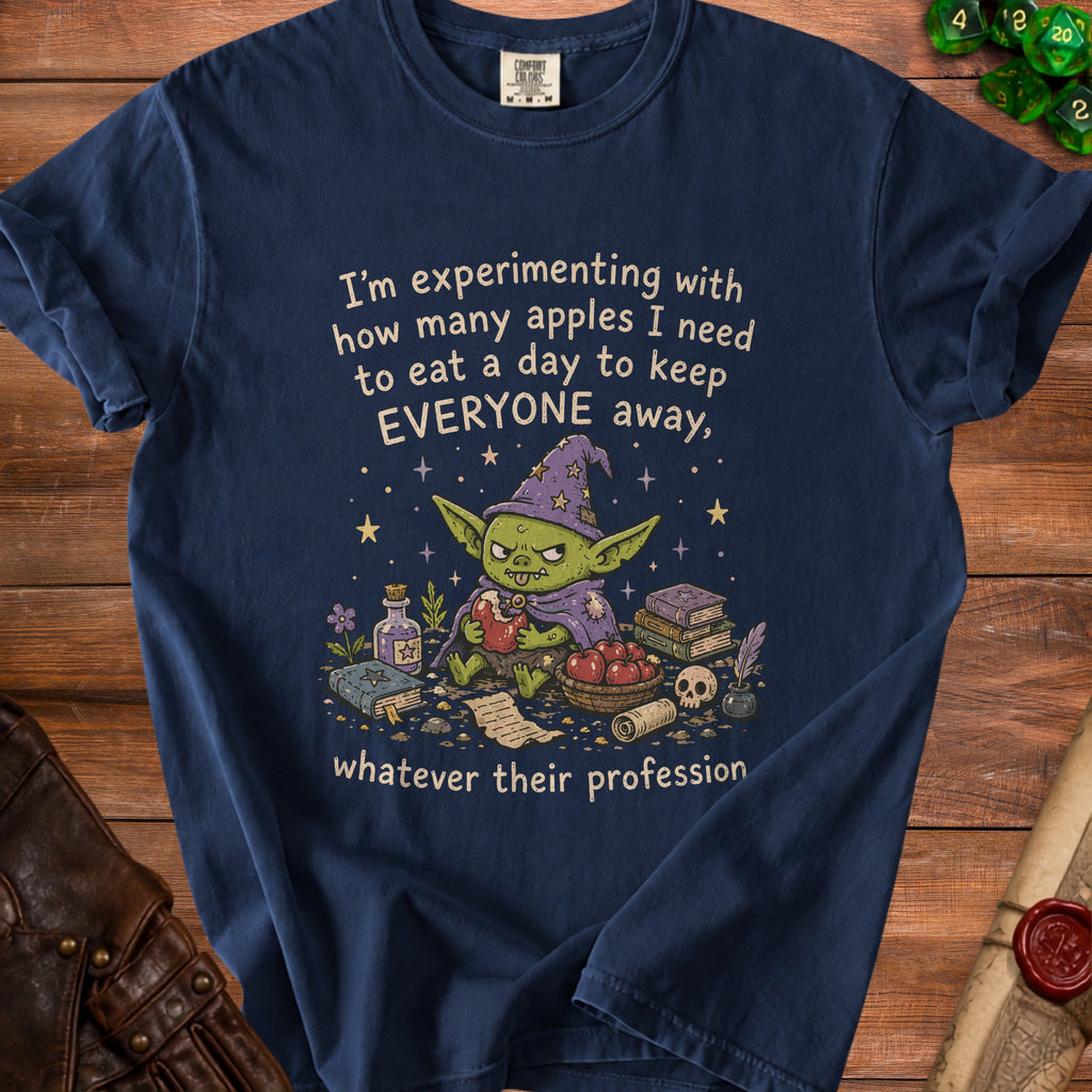 Navy t-shirt with a goblin wizard graphic and text about apples.