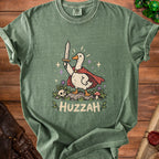 Green t-shirt featuring a cartoon duck in a cape holding a sword, with "HUZZAH" text.