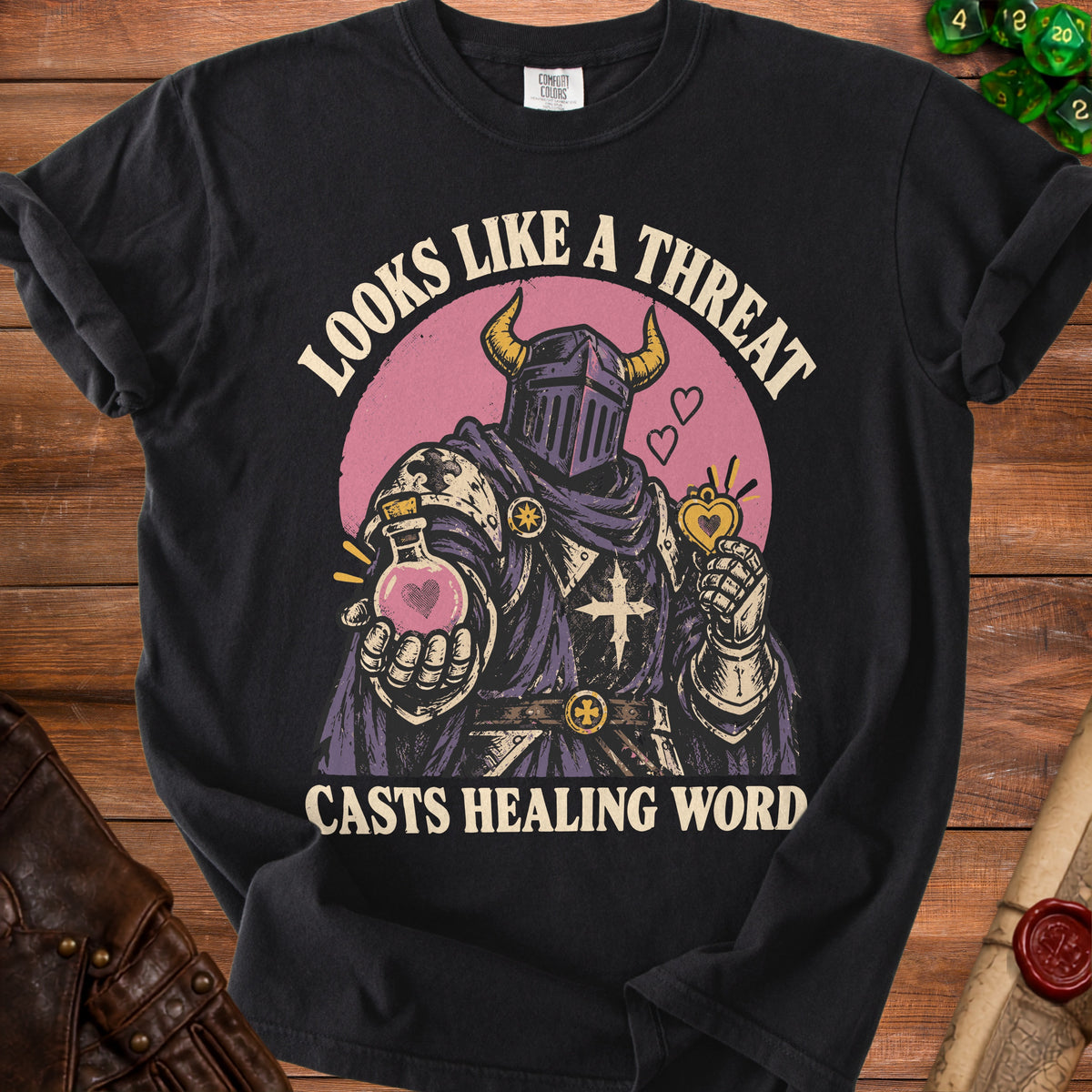 Black t-shirt with "Looks Like A Threat Casts Healing Word" text and knight graphic.