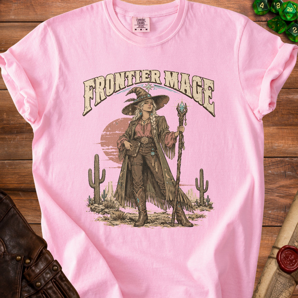 Pink t-shirt with "Frontier Mage" text and a desert scene with a witch.