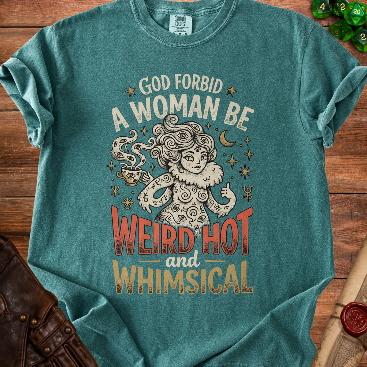 Teal t-shirt with "God forbid a woman be weird, hot, and whimsical" graphic.