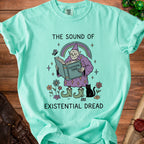 Mint green t-shirt with wizard reading "Existential Tome," text "The Sound of Existential Dread."