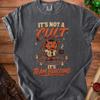 T-shirt with a devil graphic and text "It's not a cult, it's team building".
